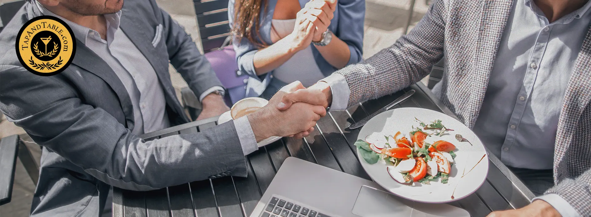 Restaurant owner reviewing produce delivery with food vendor